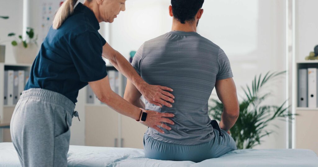 Chiropractor treating patient for car accident chiropractic recovery