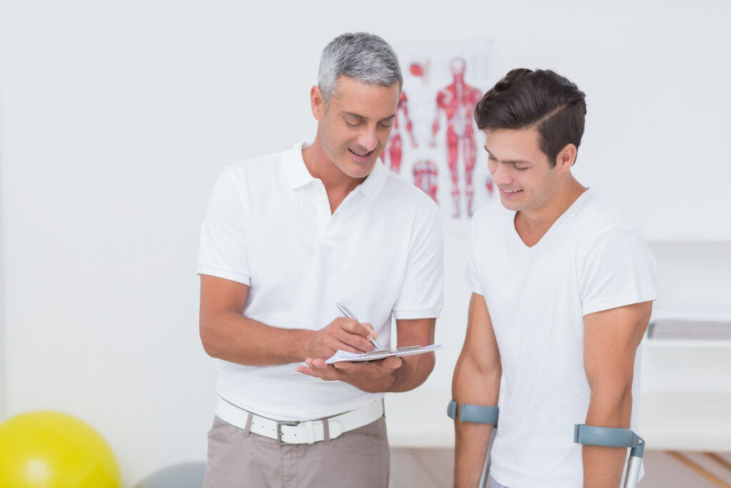 Chiropractor documenting a patient visit after workers' comp denied chiropractic treatment for a workplace injury